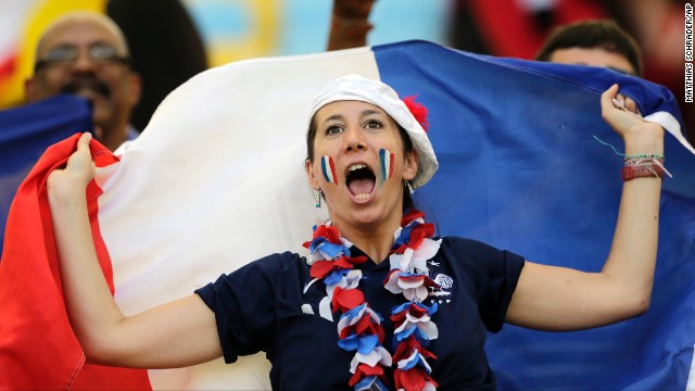 A France supporter cheers for her team.