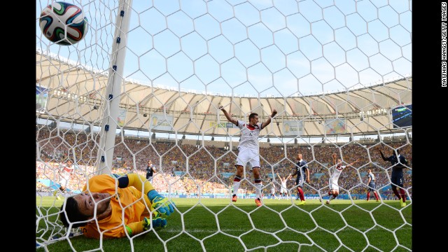 Klose celebrates Hummels' goal as it passes Lloris.