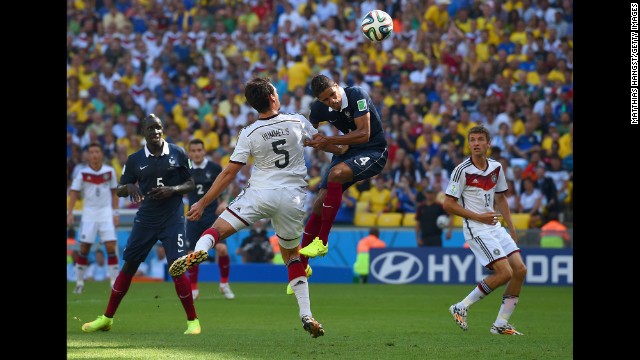 Hummels fights off French defender Raphael Varane to score on his header.