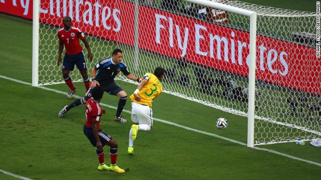 Brazil's captain, Thiago Silva, redirects a corner kick into the net to give his team a 1-0 lead over Colombia early in the first half.