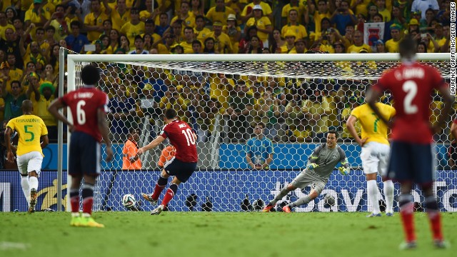 Colombia's James Rodriguez scores a second-half penalty against Brazil during a World Cup quarterfinal match Friday, July 4, in Fortaleza, Brazil. But Brazil held on to win 2-1 and advance to the semifinals.