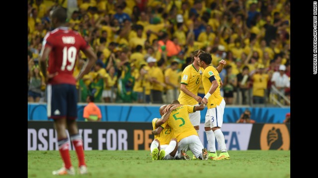 Brazil's players celebrate after winning the quarter-final football match between Brazil and Colombia on Friday, July 4. Brazil won the match 2-1 and advanced to the semifinals of the tournament.