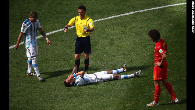 Angel di Maria of Argentina lies on the pitch.