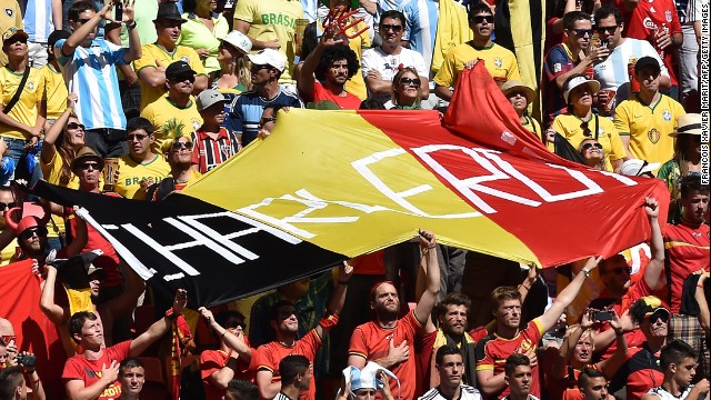 Belgium fans hold up a huge flag before the match against Argentina.