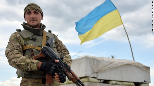 A Ukrainian serviceman guards a checkpoint near Slovyansk on Friday, July 4. 