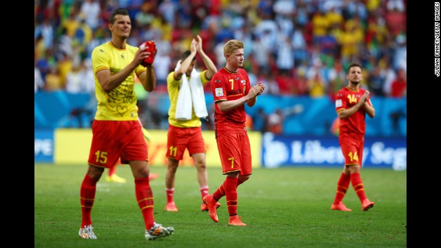 Daniel Van Buyten, left, and Kevin De Bruyne of Belgium acknowledge the fans after their loss 1-0 loss to Argentina. 
