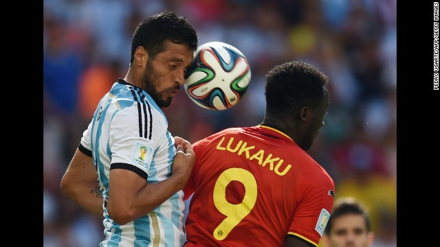 Argentina's defender Ezequiel Garay, left, vies with Belgium's forward Romelu Lukaku. 