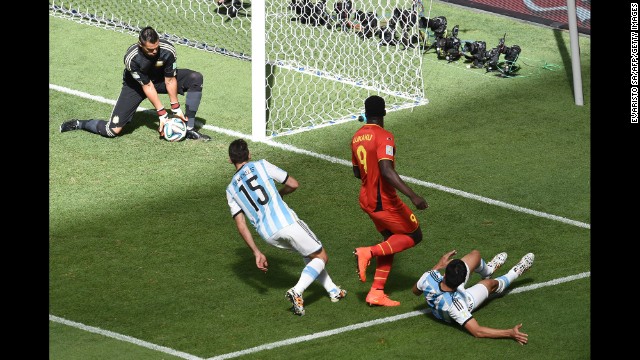 Argentina goalkeeper Sergio Romero, left, makes a save. 