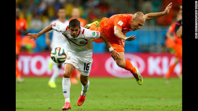 Cristian Gamboa of Costa Rica and Arjen Robben of the Netherlands compete for the ball. 