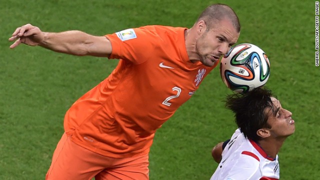 Netherlands' defender Ron Vlaar, left, vies with Costa Rica's forward and captain Bryan Ruiz. 