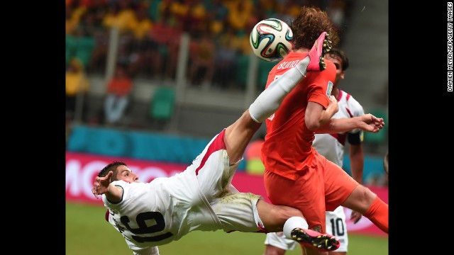 Costa Rica defender Cristian Gamboa, left, vies with Netherlands' defender Daley Blind. 