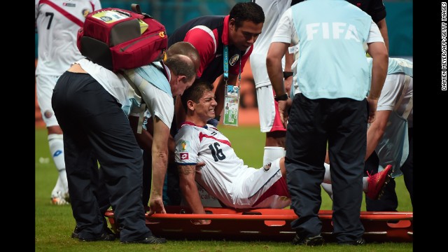Costa Rica defender Cristian Gamboa is taken out on a stretcher after an injury. 