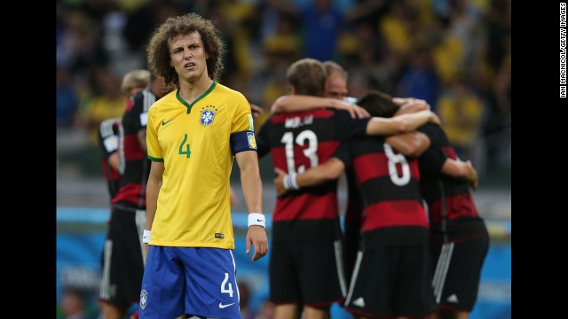Brazil's David Luiz stands near a group of German players as they celebrate their fifth goal. Germany led 5-0 at halftime. 