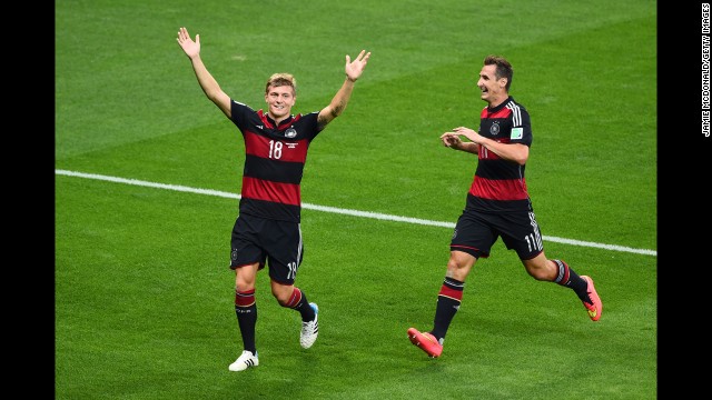 Toni Kroos of Germany, left, celebrates scoring the third goal of the game.