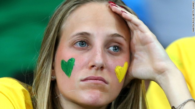 A Brazil fan looks on in the first half.