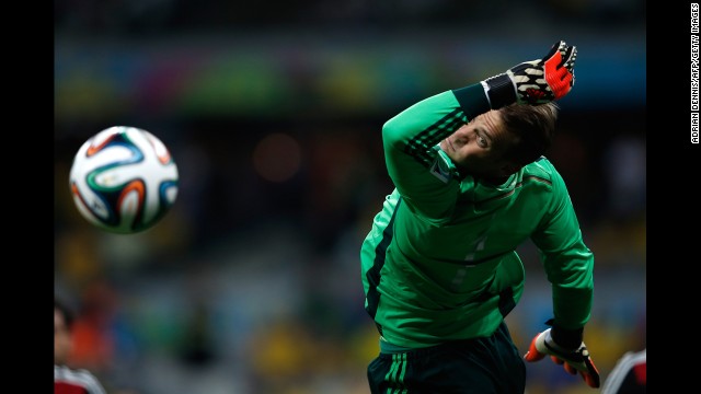 German goalkeeper Manuel Neuer dives for the ball. 