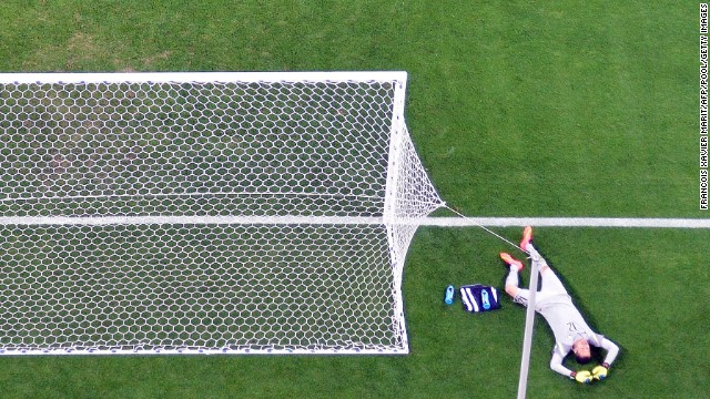 Brazilian goalkeeper Julio Cesar reacts after failing to stop a shot. 