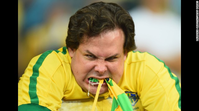 A Brazil fan reacts after his team was crushed 7-1 by Germany in a World Cup semifinal match played Tuesday, July 8, in Belo Horizonte, Brazil. The emotions in the country were reminiscent of 1950, when Brazil last hosted the World Cup and suffered a heartbreaking defeat.