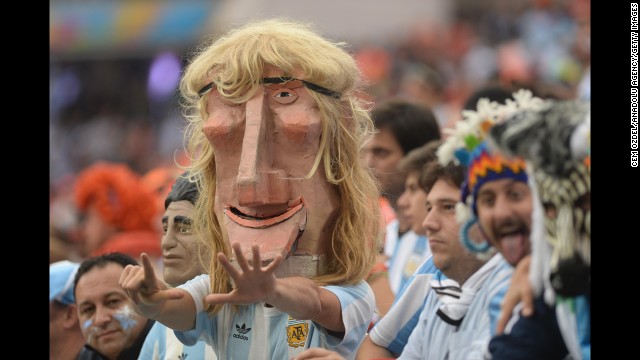 An Argentina fan in the stadium wears a mask of former player Claudio Caniggia.