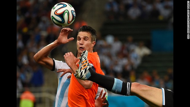 Dutch striker Robin van Persie is surrounded by Argentine defenders.