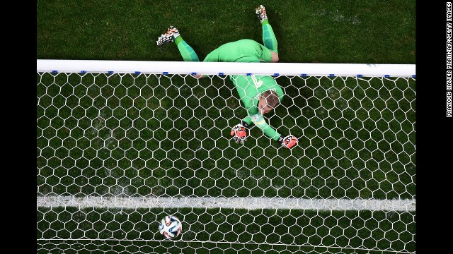 Dutch goalkeeper Jasper Cillessen fails to stop a ball during the penalty shoot-out.