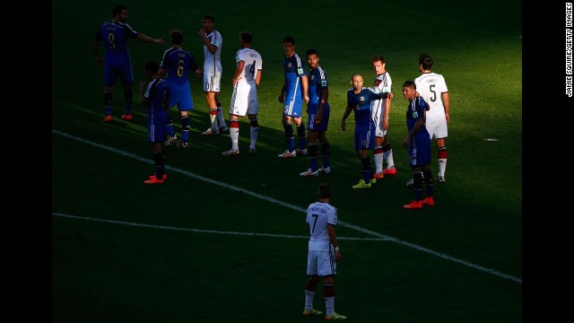 Players take their positions prior to a free kick in the first half.