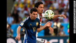 Argentina\'s forward and captain Lionel Messi (L) and Germany\'s defender Mats Hummels vie for the ball during the 2014 FIFA World Cup final football match. AFP PHOTO / ODD ANDERSEN/afp/getty images