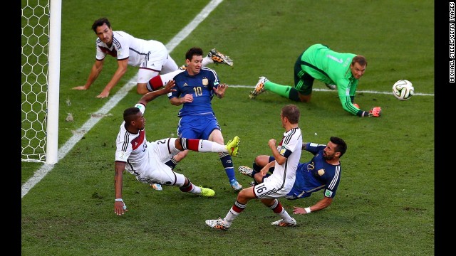 Boateng, bottom left, clears the ball as Messi and Lavezzi threaten.