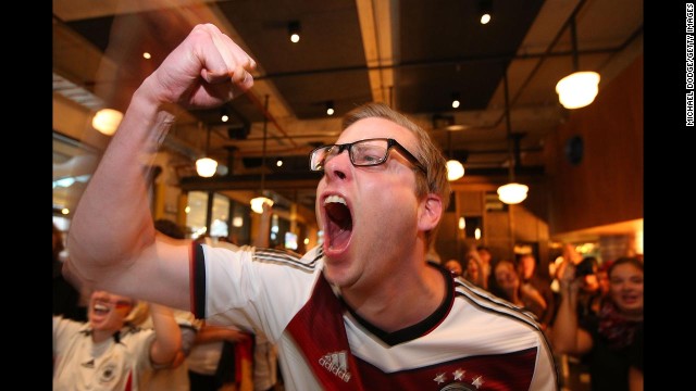 A Germany fan celebrates while watching the match in Melbourne.