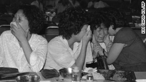 Relatives of a passenger on KAL 007 weep as a South Korean official announces in September 1983 it was \