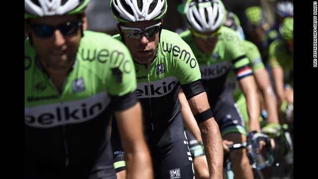Dutch cyclists wear a black armband in honor of the crash victims during the 13th stage of the Tour de France on July 18.