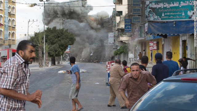 An explosion rocks a street in Gaza City on Friday, July 18.