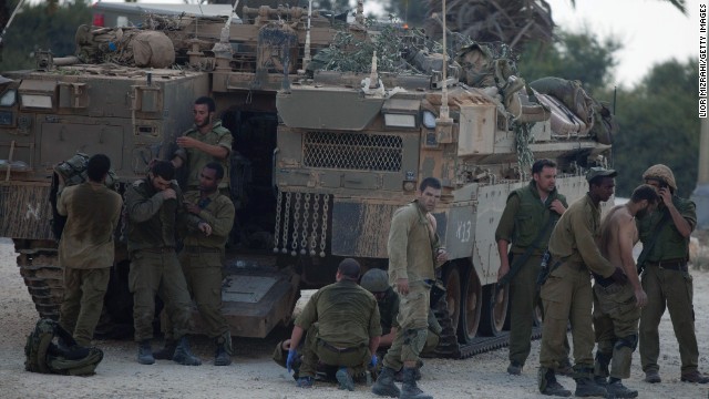 Israeli soldiers give medical care to soldiers who were wounded during an offensive in Gaza on July 20.