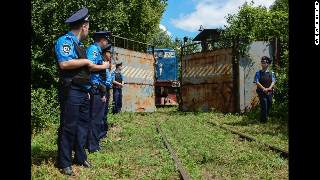 Police secure a refrigerated train loaded with bodies of passengers from Malaysia Airlines Flight 17 as it arrives in a Kharkiv, Ukraine, factory on Tuesday, July 22. 