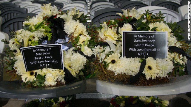 In memory of two Newcastle United fans who died in the crash, two wreaths are placed on seats July 22 at the Forsyth Barr Stadium in Dunedin, New Zealand. The soccer fans were traveling to New Zealand to watch their team play in a preseason tournament.