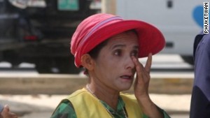 A Patong Beach vendor watches as the area is cleared of illegal structures. 