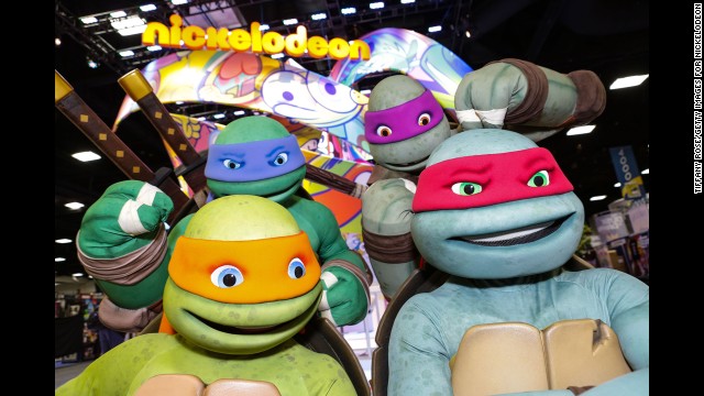 The Teenage Mutant Ninja Turtles pose at the Nickelodeon booth on July 24.
