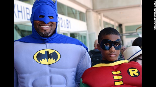 Erien and Adonis Hodge dress as Batman and Robin on July 24.