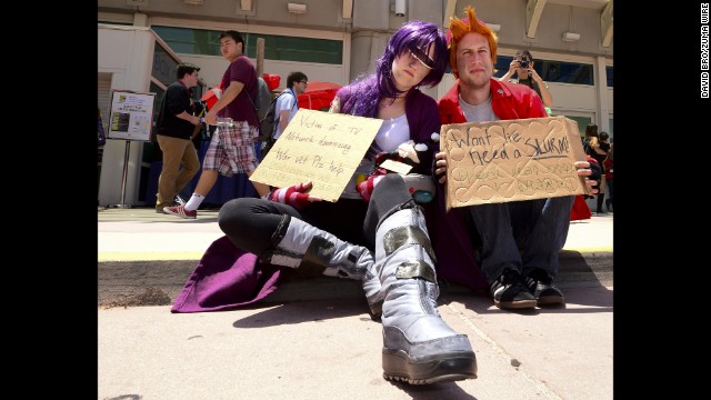 Leela and Fry, from the recently canceled "Futurama," beg on the sidewalk outside the Comic-Con convention in San Diego on Sunday, July 27. Sunday was the final day of the annual convention, mecca of all things pop culture.