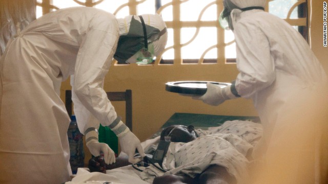 In this photo provided by Samaritan's Purse, Dr. Kent Brantly, left, treats an Ebola patient in Monrovia. On July 26, the North Carolina-based group said Brantly tested positive for the disease. Days later, Brantly arrived in Georgia to be treated at an Atlanta hospital, becoming the first Ebola patient to knowingly be treated in the United States.