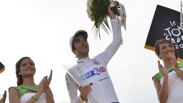 Thibaut Pinot is crowned best young rider on the 2014 Tour de France and receives the white jersey on the podium in Paris. 