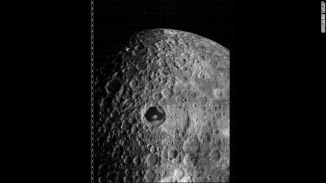 The prominent feature in this image, taken by the Lunar Orbiter 3 on 19 February 1967, is Tsiolkovskiy, a large impact crater located on the far side of the Moon.