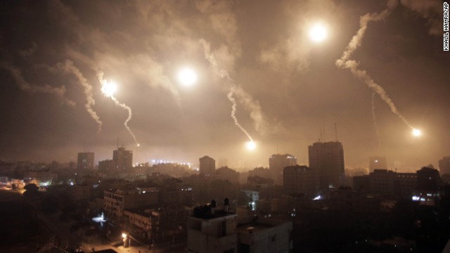 Flares from Israeli forces light up the night sky of Gaza City on July 29.