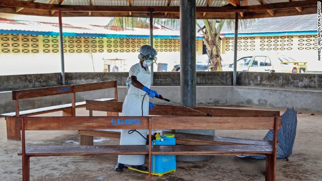 A nurse disinfects the waiting area at the ELWA Hospital in Monrovia on Monday, July 28. 