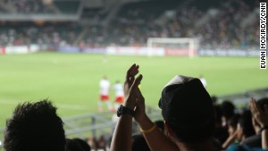 A fan applauds PSG\'s star striker Zlatan Ibrahimovich off the pitch