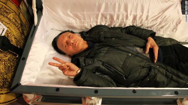 "China made me rich, but it didn't teach me how to live a rich life. I was lost," says Huang Wei-pin, creator of a death-themed game in which participants can try out a coffin.