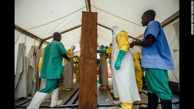 Doctors Without Borders staff prepare to enter the isolation ward at an Ebola treatment center in Kailahun on July 17.