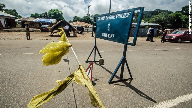 Police block a road outside Kenema to stop motorists for a body temperature check on Wednesday, July 9.