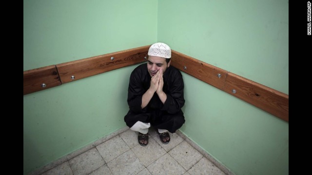 A Palestinian man sits in a hospital in Rafah, Gaza, on August 3.