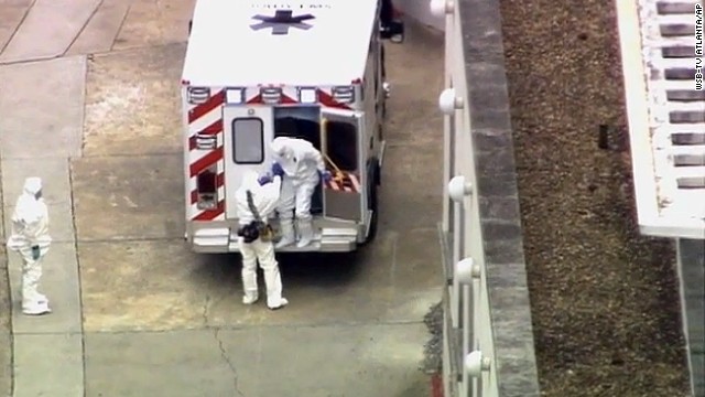 Dr. Kent Brantly, right, gets out of an ambulance after arriving at Emory University Hospital in Atlanta on Saturday, August 2. Brantly was infected with the Ebola virus in Africa, but he was brought back to the United States for further treatment.